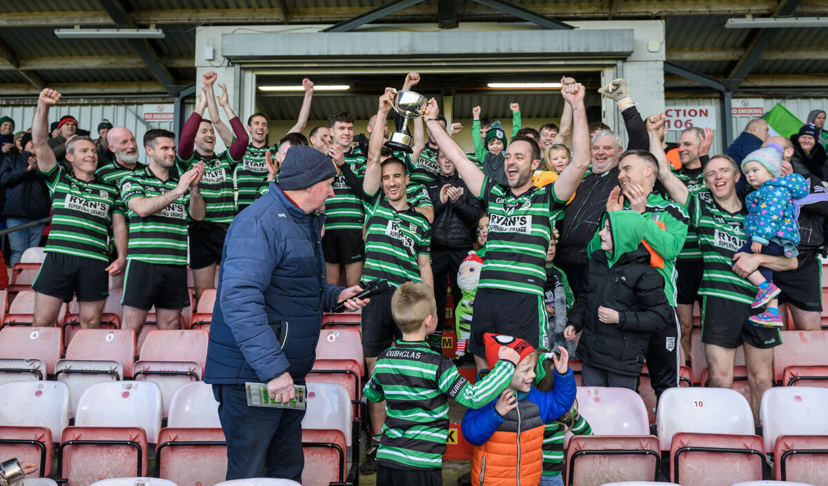  Captain Ray Keating and Kevin Murphy holding aloft the trophy after Douglas' victory over Goleen in McCarthy Insurance Group JBFC final at Páirc Uí Rinn. Picture: Dan Linehan