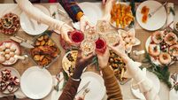 Celebration Toast over Festive Dinner Table