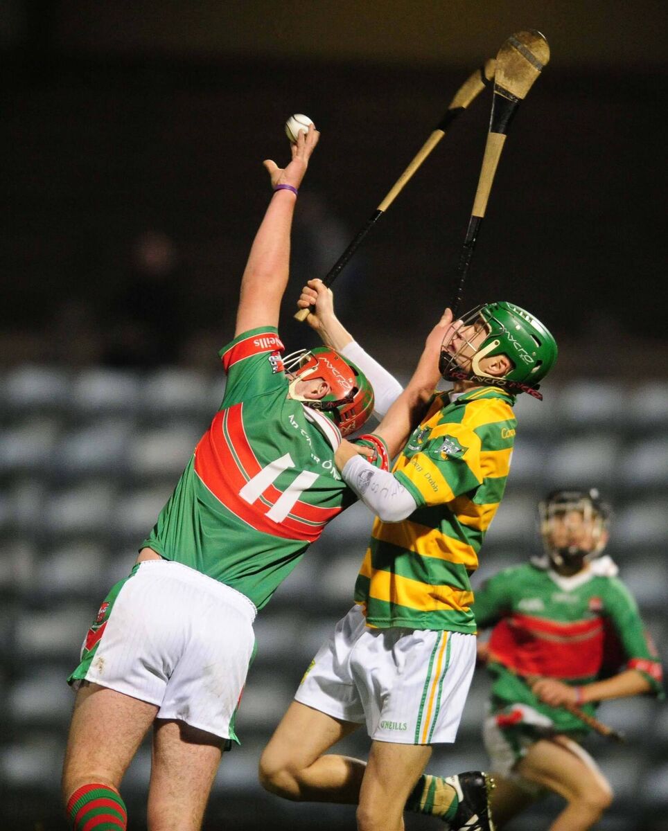 Blackrock defender Daire O'Brien rises with Fr O'Neill's forward Declan Dalton in the U16 Hurling Championship final at Pairc Ui Rinn. Picture Des Barry