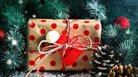 Merry Christmas and happy new year. Wooden table decorated with Christmas gifts. Background with copy space. Horizontal.