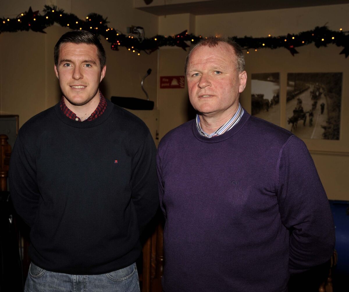Teddy McCarthy with his son Cian in Sarsfields at the function in his honour celebrating the 25th anniversary of his All-Ireland hurling and football double in 1990. Picture: Mike English