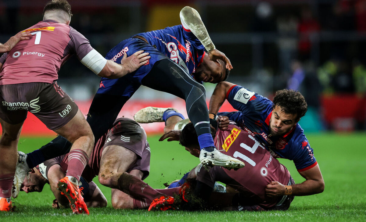 Munster's Calvin Nash tackled by Samuel Ezeala and Ryan Chapuis of Stade Francais Paris. Picture: INPHO/Nick Elliott Munster's Calvin Nash tackled by Samuel Ezeala and Ryan Chapuis of Stade Francais Paris. Picture: INPHO/Nick Elliott