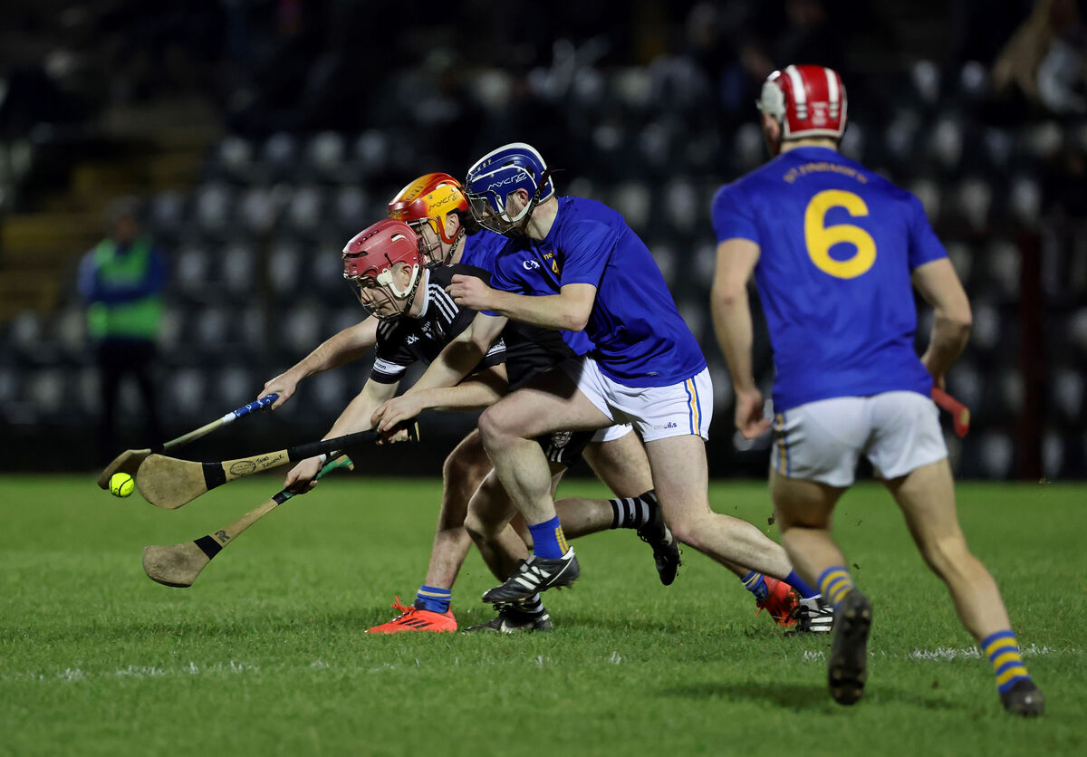  Eoghan Hallahan and James Kennefick, St Finbarr's, tackle Alex Quirke, Midleton. Picture: Jim Coughlan.