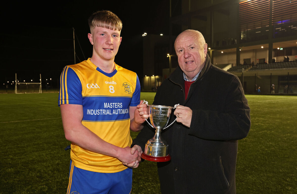  Danny Horgan, Kilmichael, receives the cup from Noel O'Callaghan, vice-chair Cork GAA. Picture: Jim Coughlan.