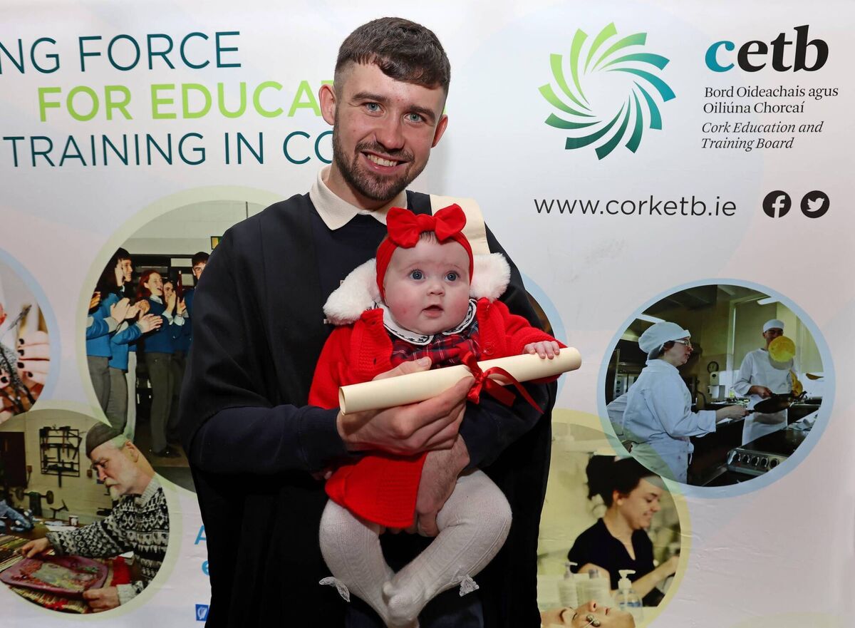 Alex Kenny, advanced certificate craft, brick and stone laying, with his daughter Mya at the presentation by Cork Education Training Board. Picture: Jim Coughlan.