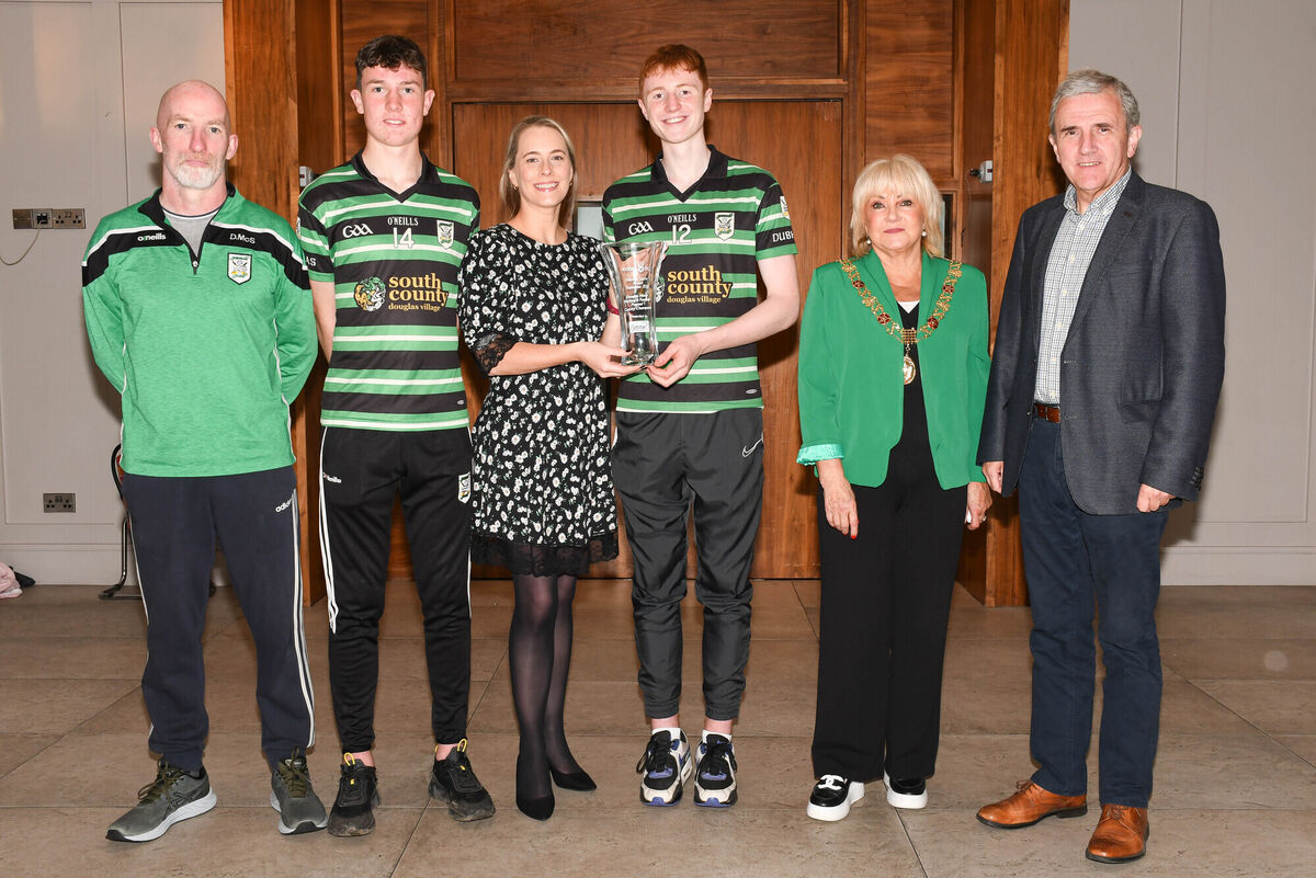 Nicola Cullinane, Deputy Marketing Manager The Echo, presents Douglas players Charlie Lucas and Joe Hartnett with the Rebel Og monthly award for September at a function held in the Clayton Silversprings Hotel. Also pictured are Dave McSweeney, Team manager; Cllr Deirdre Forde, Lord Mayor Cork and Picture: Howard Crowdy