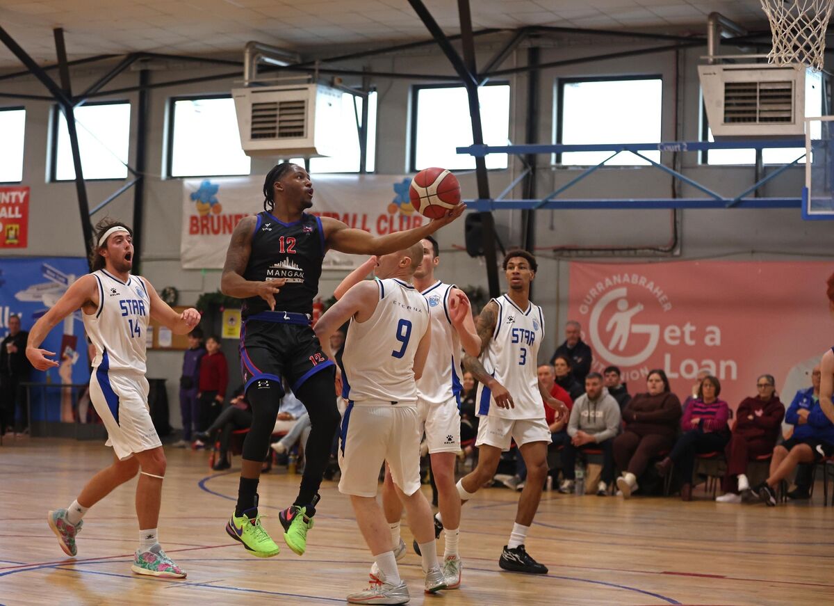  Patrick Robinson, UCC Demons, takes on Paddy McGraharan, Belfast Star. Picture: Jim Coughlan.