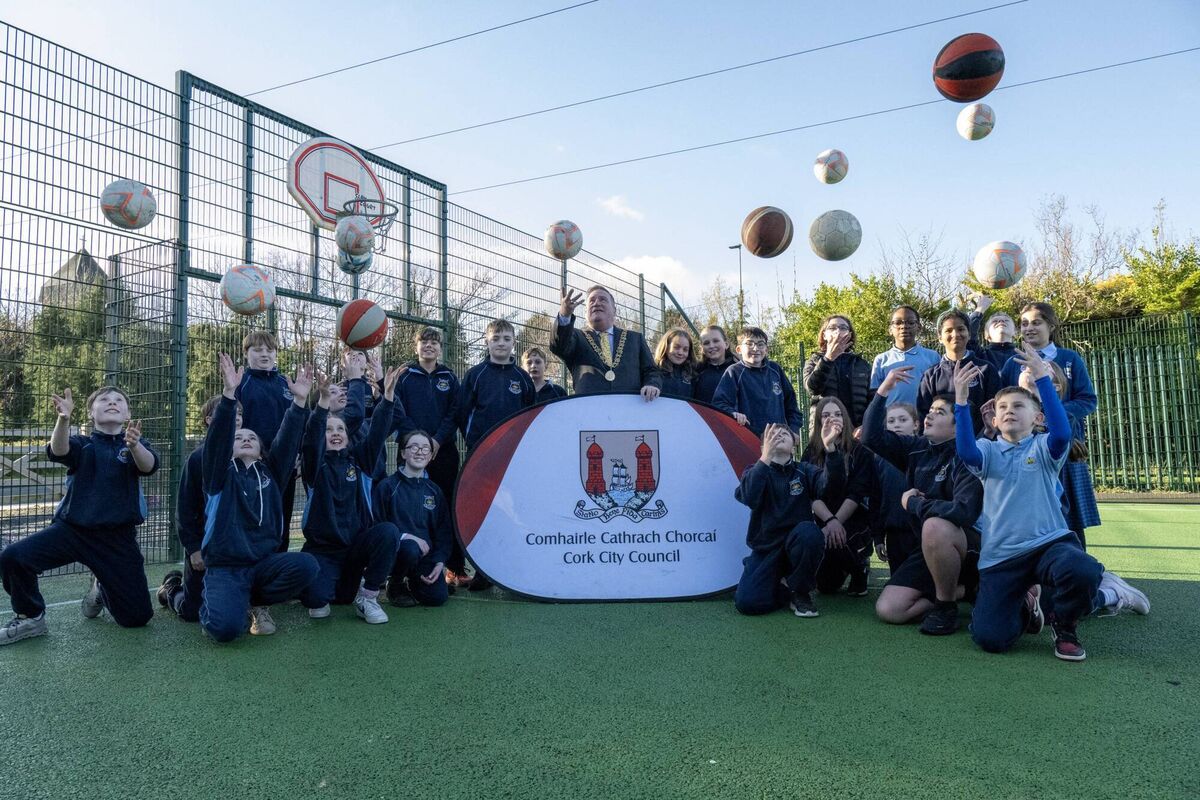 The Lord Mayor joins sixth class pupils from Scoil Niocláis as they enjoy the use of the new multi-use games area in Grange. Picture: Brian Lougheed