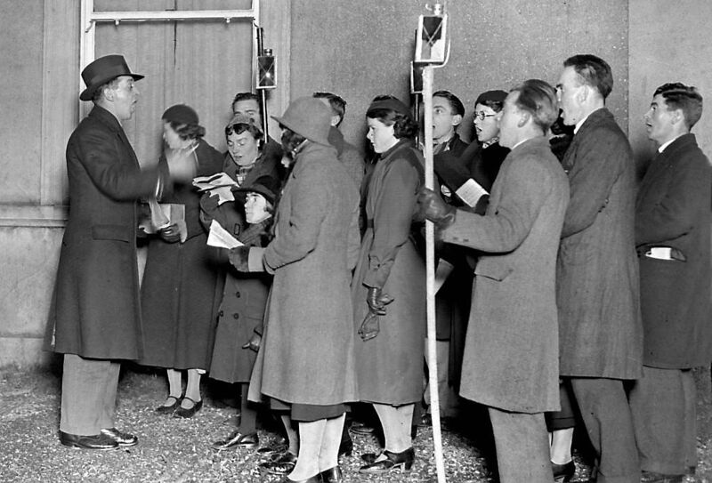 Carol singers collecting in aid of Penny Dinners.