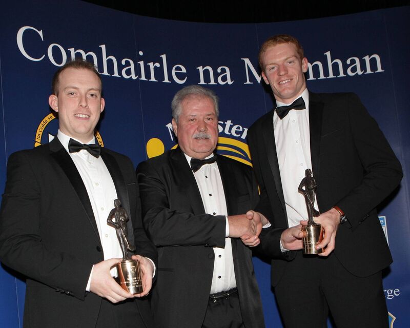 Daniel Relihan (left) and Michael Hedigan (right) accept the Handballer of the Year Award from Munster GAA Treasurer Bob Ryan.