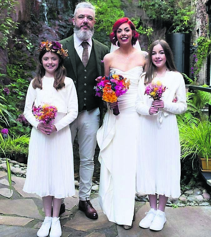 Ruth O’Brien and Eric Brannigan with their daughters, Ellen and Sophie, on their big day