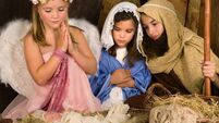 Little angel in nativity scene