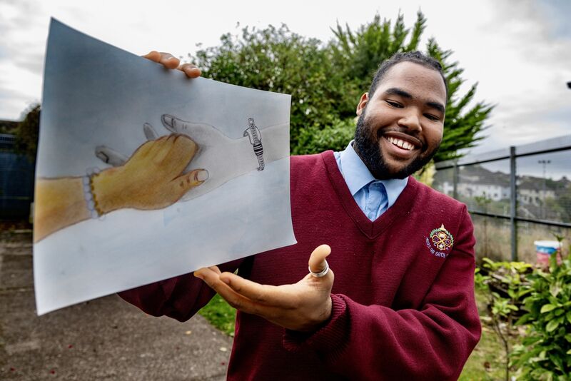Joseph Salis with the original illustration he created for this year's Holly Bough. Picture Chani Anderson Joseph Salis with the original illustration he created for this year's Holly Bough. Picture Chani Anderson
