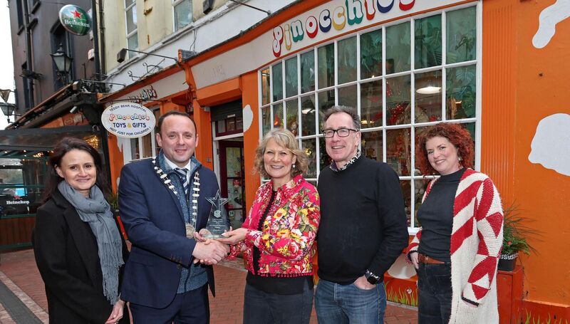 Aaron Mansworth, president of the CBA, presenting the Best Overall Christmas Display award to Christel and Wyon Stansfield, of Pinocchio’s, Paul St. Included are Cliona Barnes, CBA’s business and communications manager, and Lisa McCarthy, spectrum display and lead judge. Christel stated that work on the store’s display began just after Halloween came to an end. Picture: Jim Coughlan Aaron Mansworth, president of the CBA, presenting the Best Overall Christmas Display award to Christel and Wyon Stansfield, of Pinocchio’s, Paul St. Included are Cliona Barnes, CBA’s business and communications manager, and Lisa McCarthy, spectrum display and lead judge. Christel stated that work on the store’s display began just after Halloween came to an end. Picture: Jim Coughlan