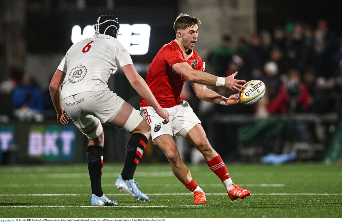 Jack Crowley of Munster offloads the ball at Kingspan Stadium. Picture: Ramsey Cardy/Sportsfile