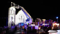 Church spire collapses to ground in flames after lightning strike