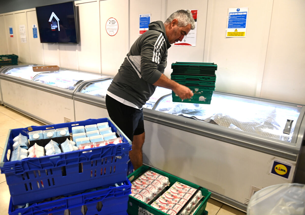  Volunteer Damien Carthy unpacking milk cartons at the community market at Feed Cork. Picture: Larry Cummins.