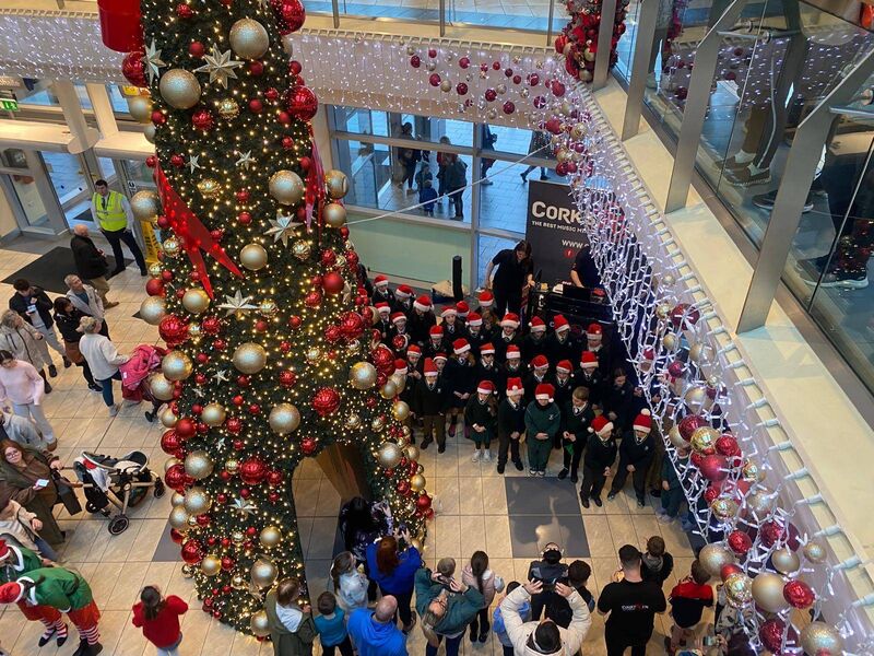 Pupils from Gaelscoil Mhachan carol singing in Mahon Point for the arrival of Santa. 