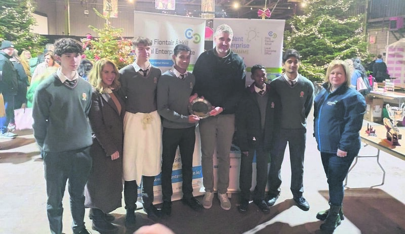 The five pupils from Coláiste an Spioraid Naoimh in Bishopstown, from left, Tom McKeown, Michael Sweeney, Ahroon Santhosh, Mamoun Mirghani and Abraham Kurian, with their award along with three people from the Student Enterprise programme