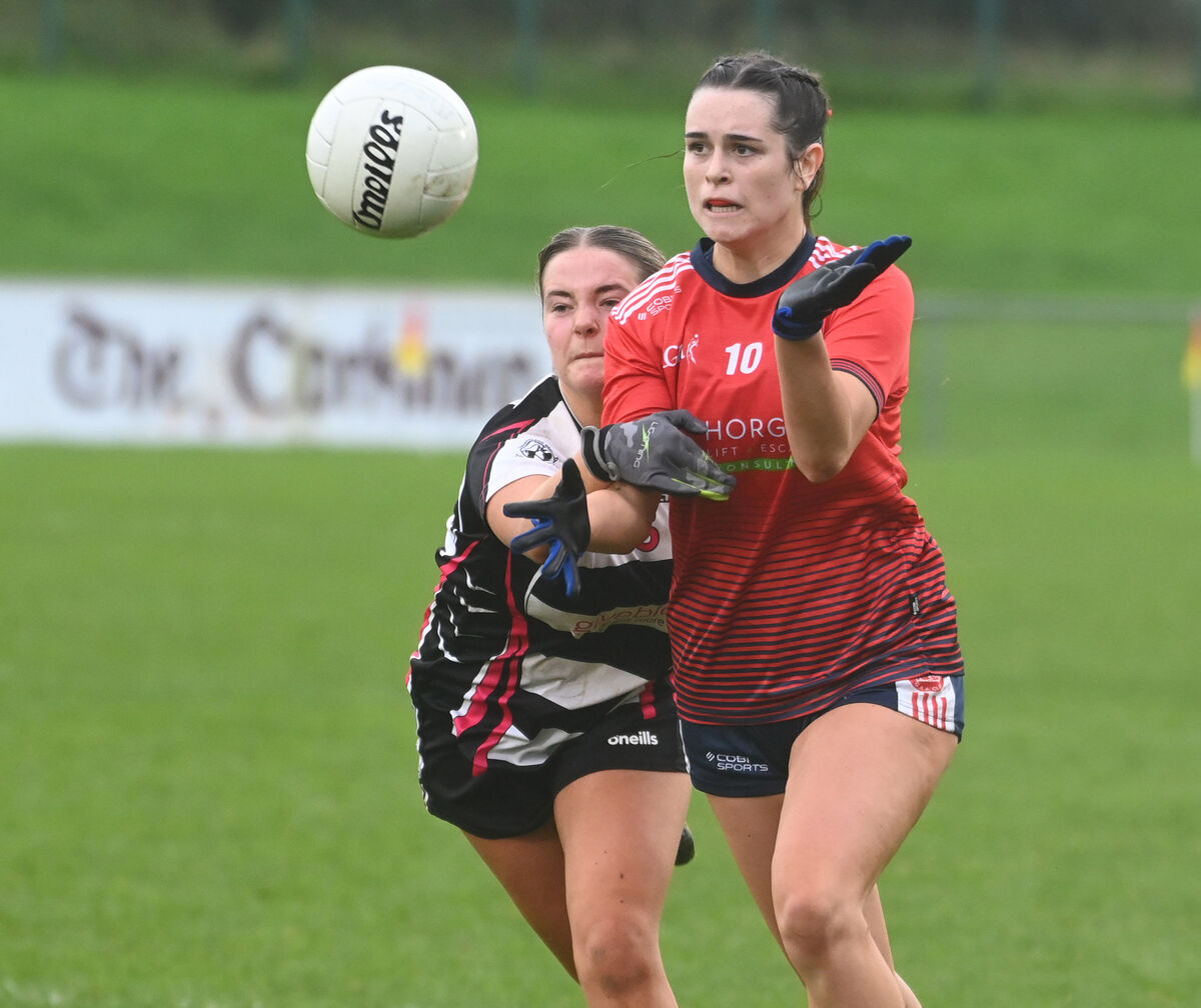 Mungret St Paul's Emma O'Rourke gets off her pass from Midleton's Deirdre Corcoran. Picture: Eddie O'Hare Mungret St Paul's Emma O'Rourke gets off her pass from Midleton's Deirdre Corcoran. Picture: Eddie O'Hare
