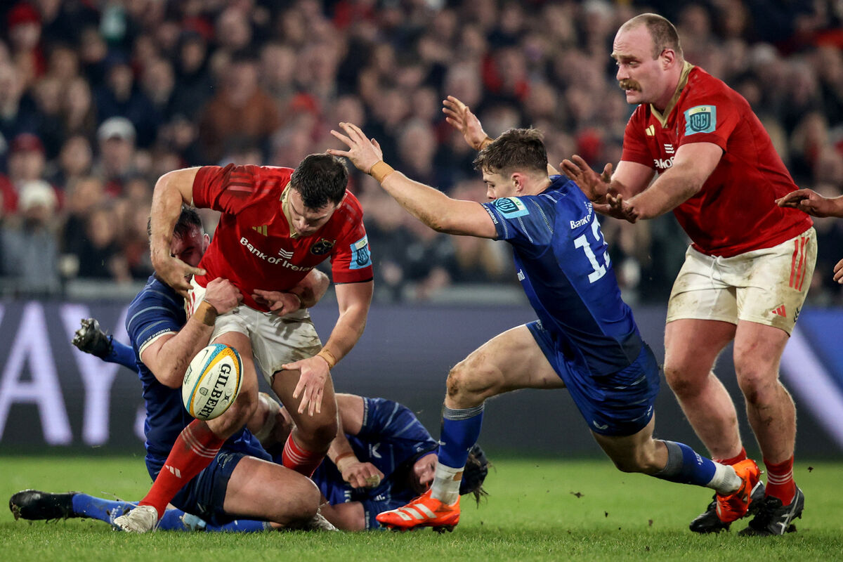 Munster's Tom Farrell spills the ball as he comes up against Garry Ringrose of Leinster. Picture: INPHO/Ben Brady