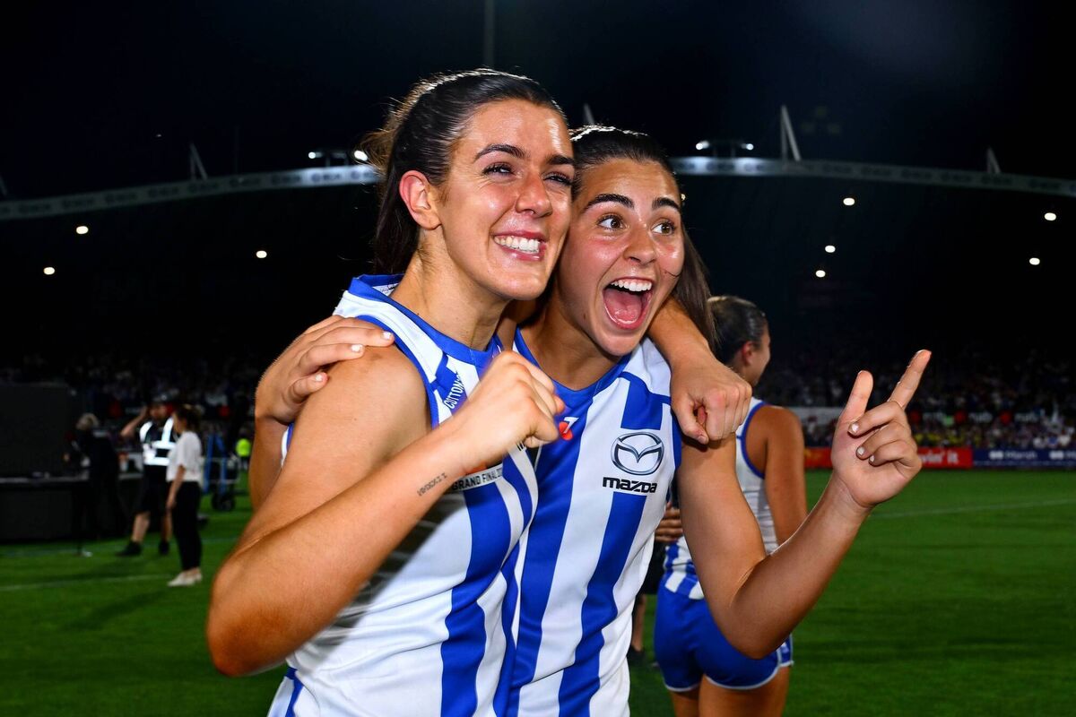 Erika O'Shea and Taylah Gatt of the Kangaroos celebrate victory. Picture: Quinn Rooney/Getty Images