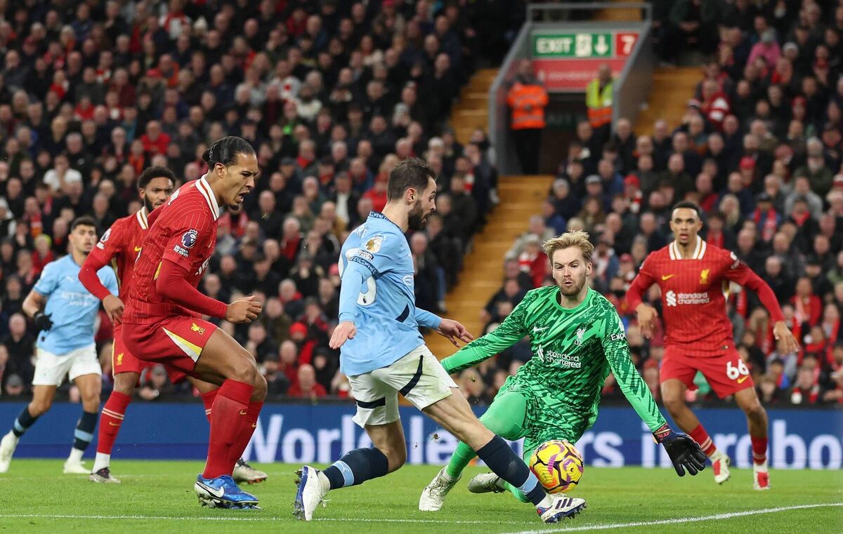 Bernardo Silva of Manchester City shoots whilst under pressure from Virgil van Dijk and Caoimhin Kelleher of Liverpool. Picture: Carl Recine/Getty Images