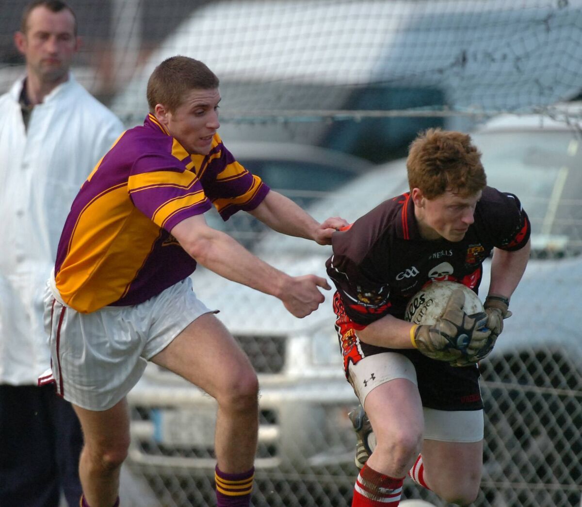 UCC keeper Tomás Mac an tSaoir trying to escape from Carbery's Hugh Curran. Picture: Richard Mills. UCC keeper Tomás Mac an tSaoir trying to escape from Carbery's Hugh Curran. Picture: Richard Mills.