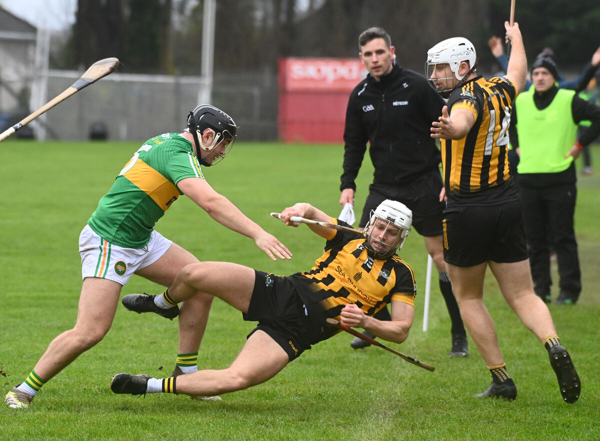 Russell Rovers' Josh Beasung upended by Kilrossanty's Donal Fitzgerald with Rovers' Ciaran Sheehan watching on. Picture: Eddie O'Hare Russell Rovers' Josh Beasung upended by Kilrossanty's Donal Fitzgerald with Rovers' Ciaran Sheehan watching on. Picture: Eddie O'Hare