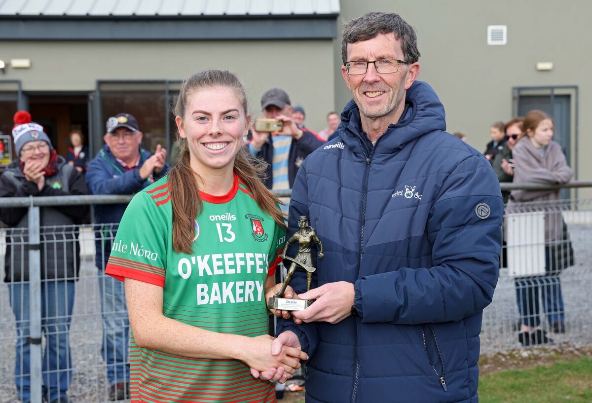  Kate Dooley, Ballinora, receives the Player of the Game from Rory Noonan, Chief Sub Editor The Echo.