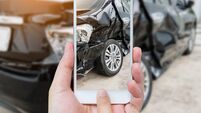 female hold mobile smartphone photographing car accident