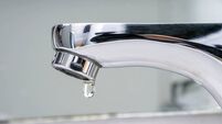 Drop of water falling from faucet.