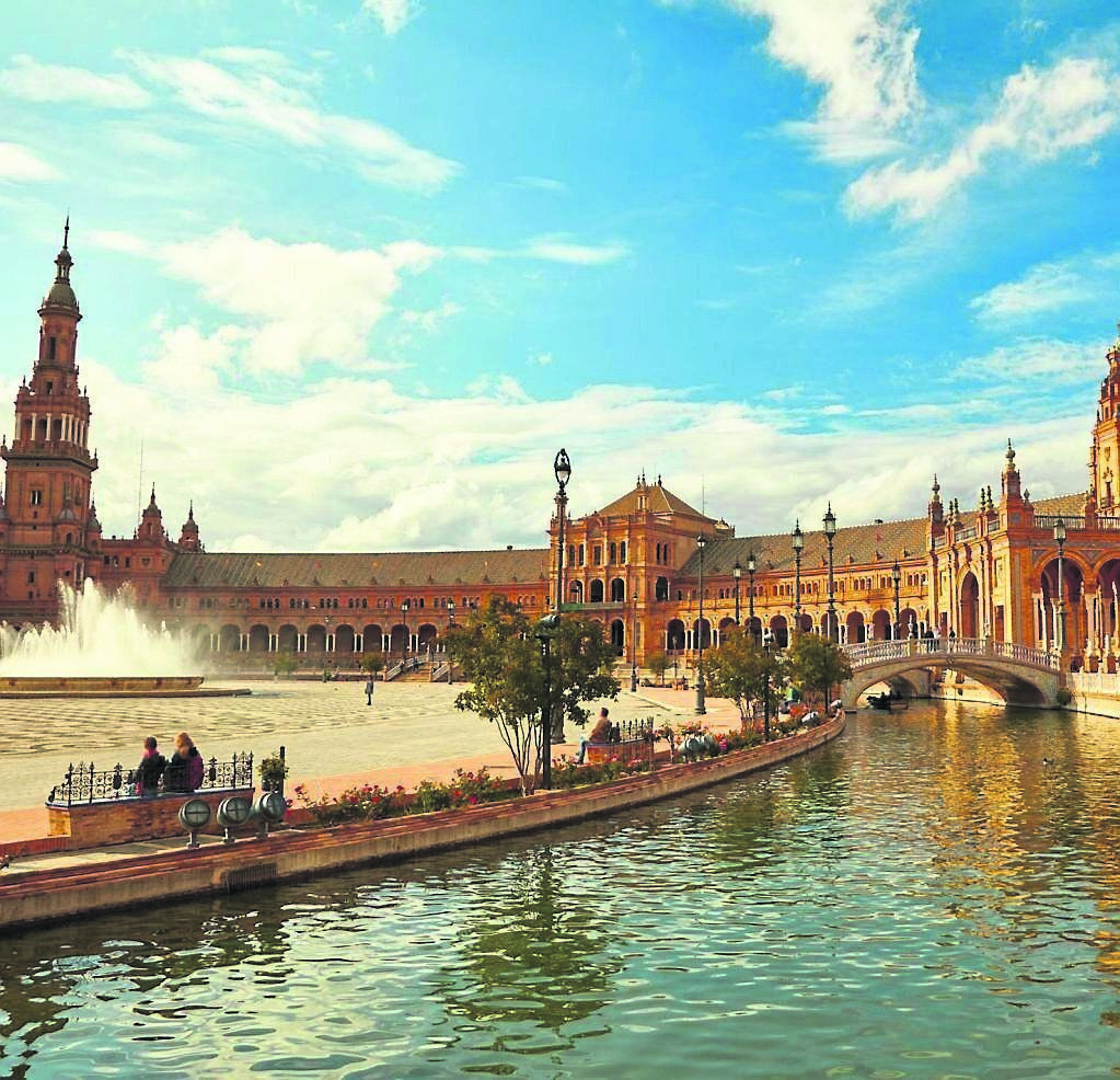 Plaza de Espana in Seville is a hive of activity day and night, where street artists and musicians perform Plaza de Espana in Seville is a hive of activity day and night, where street artists and musicians perform