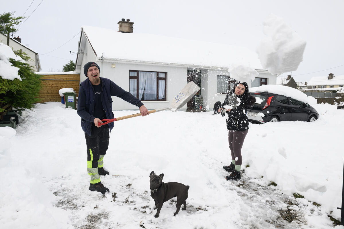Kamil and Jadwiga clear their dive of snow at the home in Charleville, Co Cork. Picture: Dan Linehan Kamil and Jadwiga clear their dive of snow at the home in Charleville, Co Cork. Picture: Dan Linehan