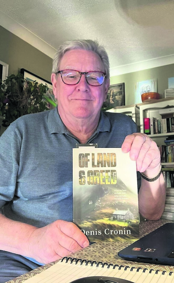 Denis Cronin with his latest novel, Of Land & Greed Denis Cronin with his latest novel, Of Land & Greed