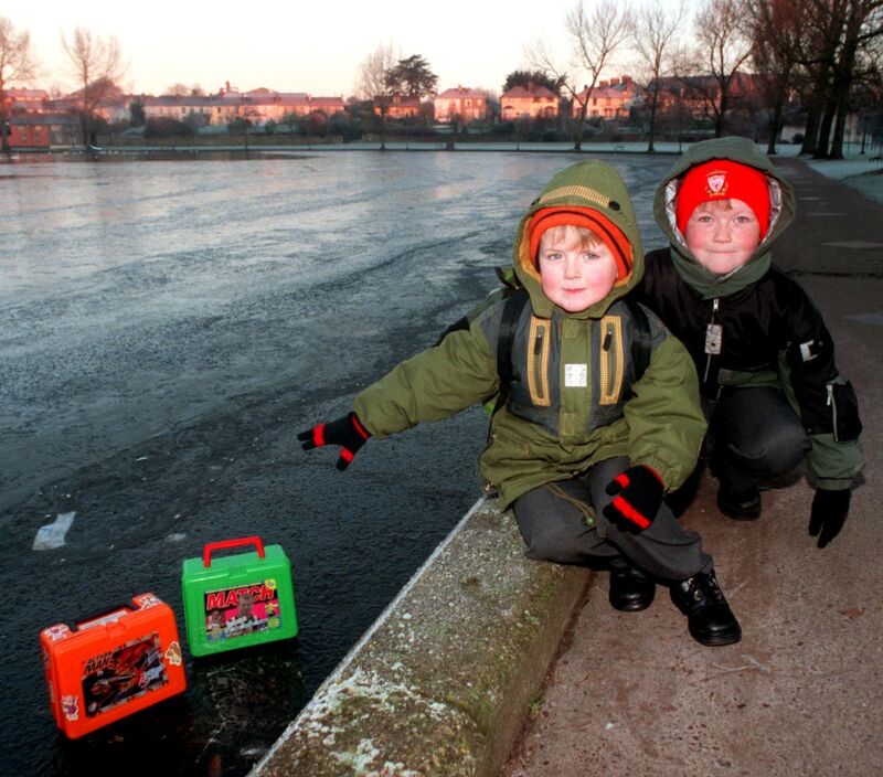Brothers Christopher and Daniel Crowley on their way to Greenmount National School in 1999, with their lunch boxes on the frozen surface of The Lough. Picture: Dan Linehan. Brothers Christopher and Daniel Crowley on their way to Greenmount National School in 1999, with their lunch boxes on the frozen surface of The Lough. Picture: Dan Linehan.