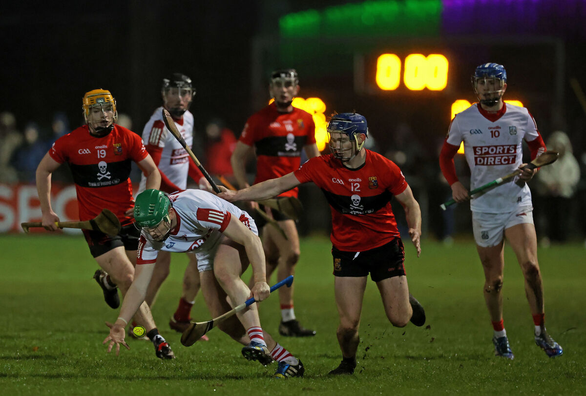 Cork's Cormac O'Brien claims possession under pressure from UCC pair Darragh Flynn and Eddie Stokes. Picture: Jim Coughlan Cork's Cormac O'Brien claims possession under pressure from UCC pair Darragh Flynn and Eddie Stokes. Picture: Jim Coughlan