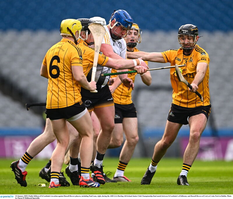 Paddy Killeen of St Lachtain's in action against Russell Rovers players, including Paul Lane, right. Photo by Piaras Ó Mídheach/Sportsfile Paddy Killeen of St Lachtain's in action against Russell Rovers players, including Paul Lane, right. Photo by Piaras Ó Mídheach/Sportsfile