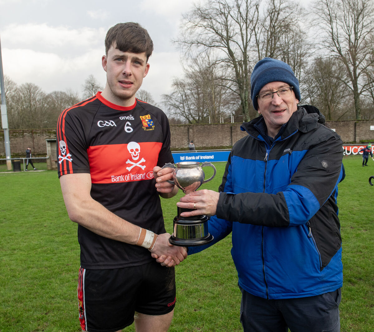Robert Downey receiving the cup from Billy O'Brien after UCC's win over Cork in December 2023. Picture: Dan Linehan Robert Downey receiving the cup from Billy O'Brien after UCC's win over Cork in December 2023. Picture: Dan Linehan