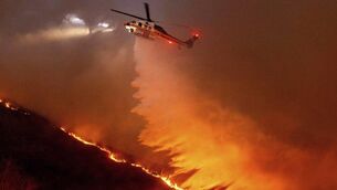 <p class="contextmenu internal_Caption">Water is dropped by helicopter on the fires in Los Angeles last week. Kathriona Devereux visited LA in 2006. AP Photo/Ethan Swope</p>