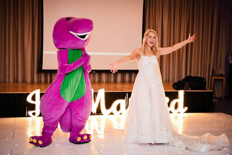 The bride’s father surprised Julie with a special appearance from Barney. The bride’s father surprised Julie with a special appearance from Barney.