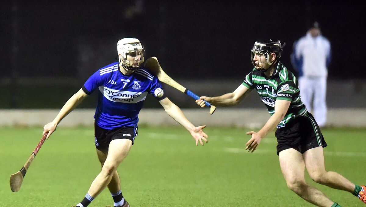 Sarsfields' Killian Murphy gathers the sliotar from Douglas' James Holland. Picture: Eddie O'Hare Sarsfields' Killian Murphy gathers the sliotar from Douglas' James Holland. Picture: Eddie O'Hare