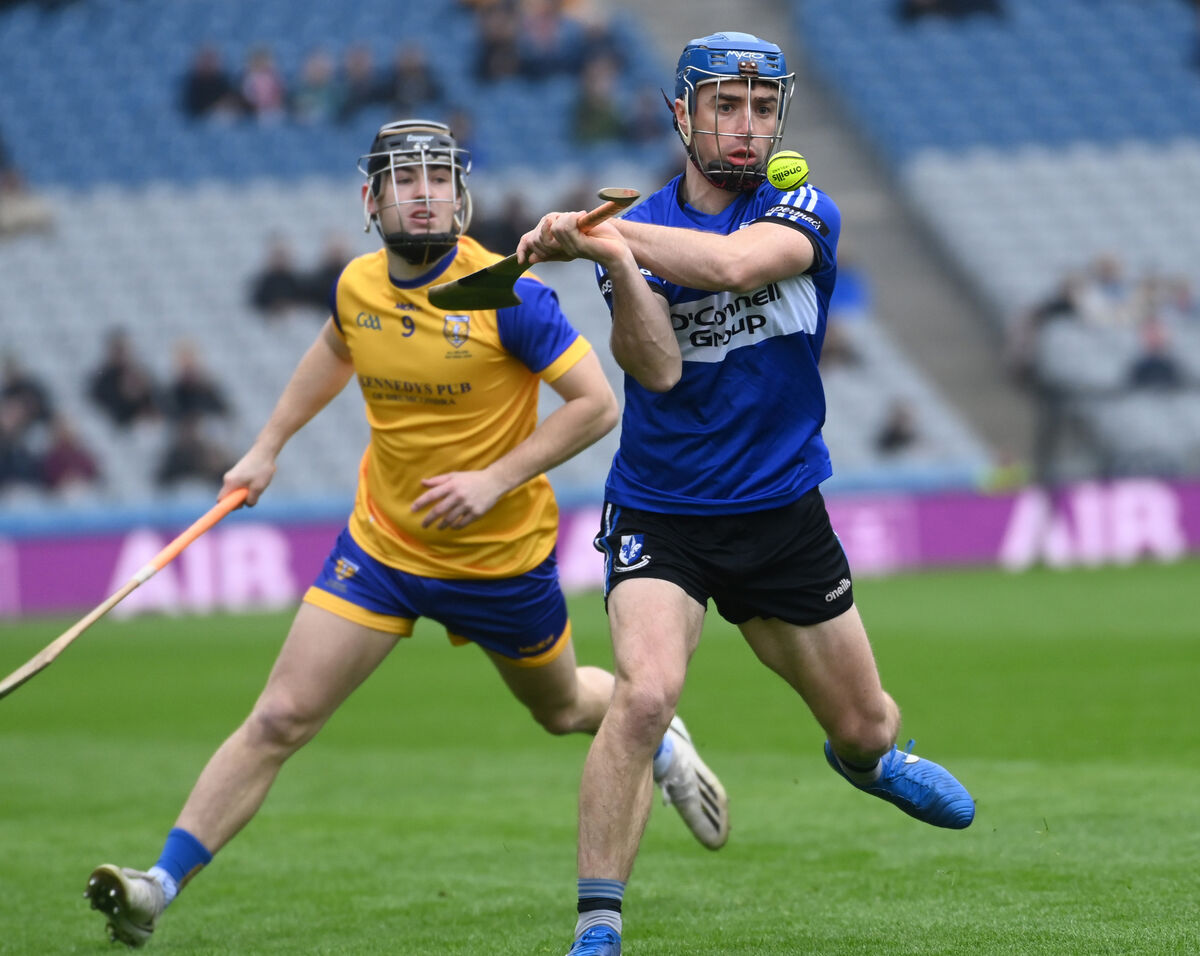Sarsfields' Conor O'Sullivan clears from Na Fianna's Sean Currie. Picture: Eddie O'Hare Sarsfields' Conor O'Sullivan clears from Na Fianna's Sean Currie. Picture: Eddie O'Hare