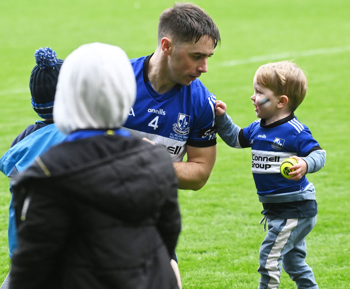 Sarsfields captain Conor O'Sullivan plays with his sons Quinn, Shay and Cole after the defeat to Na Fianna in the AIB GAA hurling All-Ireland senior club championship final at Croke park. Picture: Eddie O'Hare