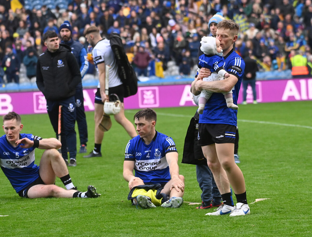 Eoin O'Sullivan, and his daughter Bláthnaidh, Conor O'Sullivan and Bryan Murphy after the defeat to Na Fianna. Picture: Eddie O'Hare