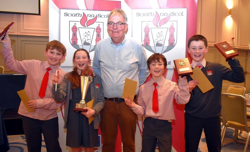 Gaelscoil Uí Riada Bishopstown pupils, Liam Mac Domhall, Siún Nic Carthaigh, Seán Mac Carthaigh and Cian de Bhaldraithe, celebrate their win at the Allianz Sciath na Scol Sports Quiz held at the Rochestown Park Hotel. Included is Sciath na Scol chairman David Collins.	Picture: Mike English
                    