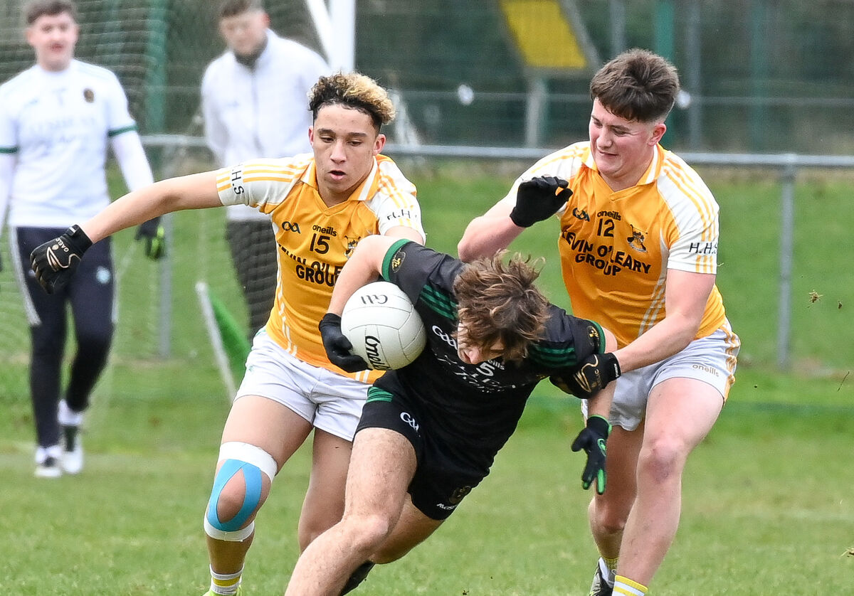  Padraig O'Halloran of Mercy Mounthawk Tralee is tackled by Sean Murphy and Daniel Coughlan of Hamilton High School Bandon, during the TUS Corn Uí Mhuirí semi-final, at Mallow. Picture: David Keane.