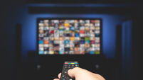 Multimedia video concept on TV set in dark room