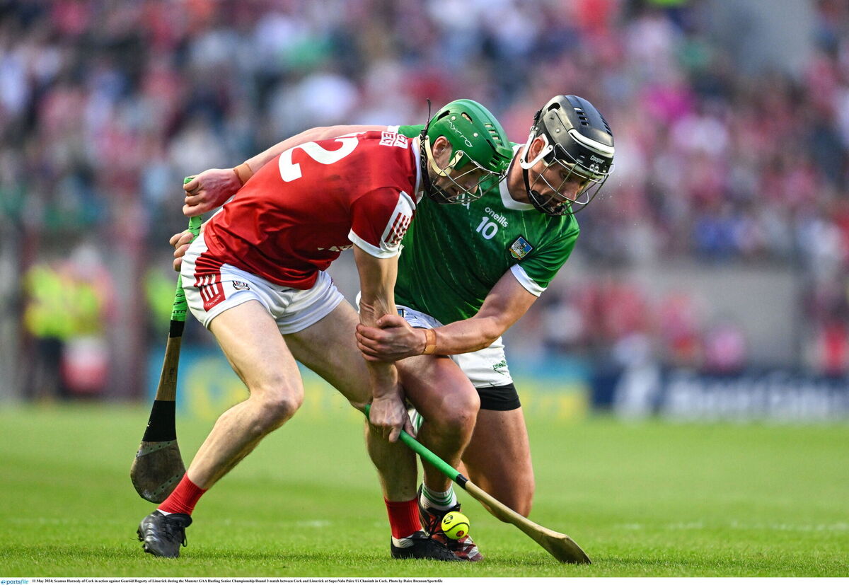 Cork's Séamus Harnedy tussles with Gearóid Hegarty of Limerick. Picture: Daire Brennan/Sportsfile