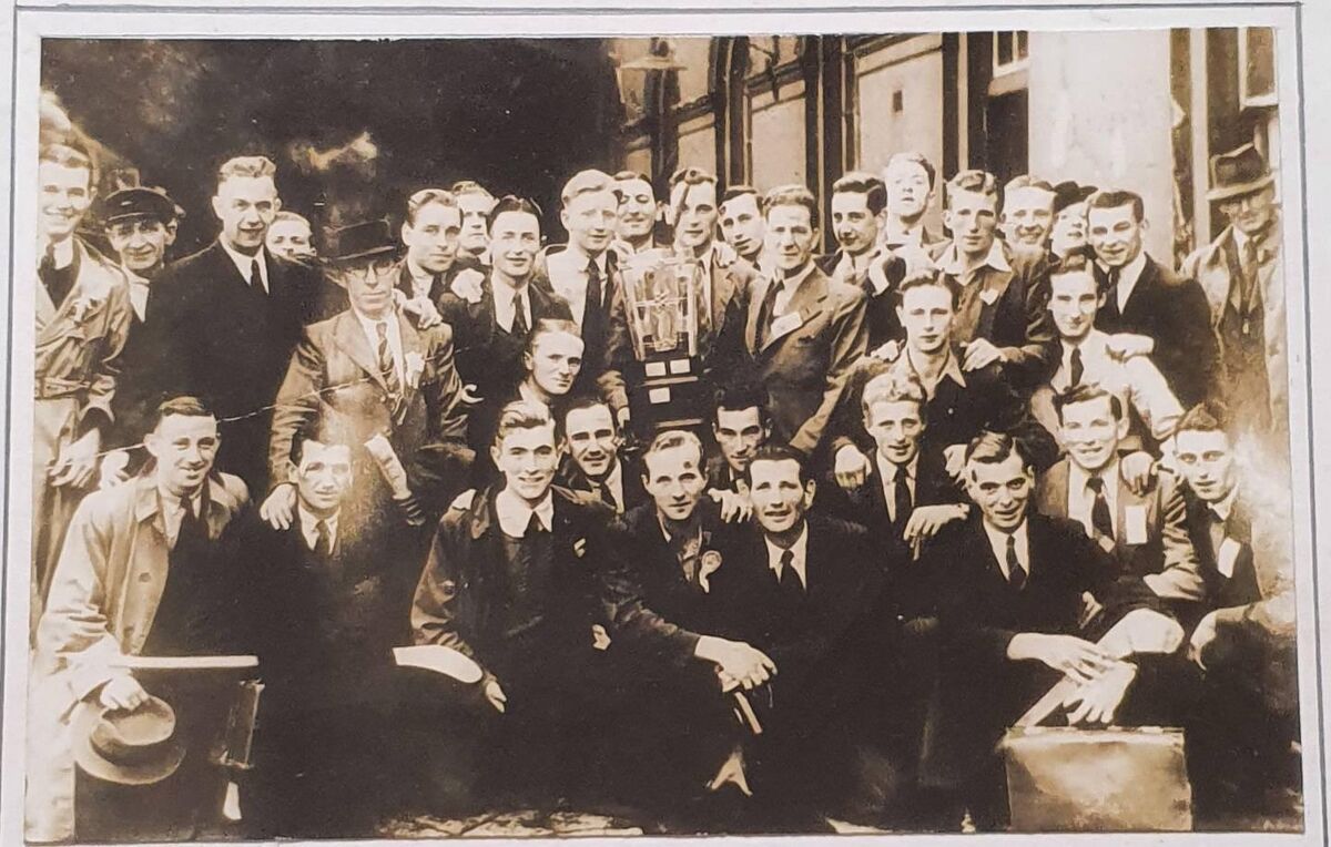 A framed photo of the 1942 All-Ireland winning Cork hurling team before they departed Dublin, Eddie Hogan is in the front row, to Christy Ring's right.
